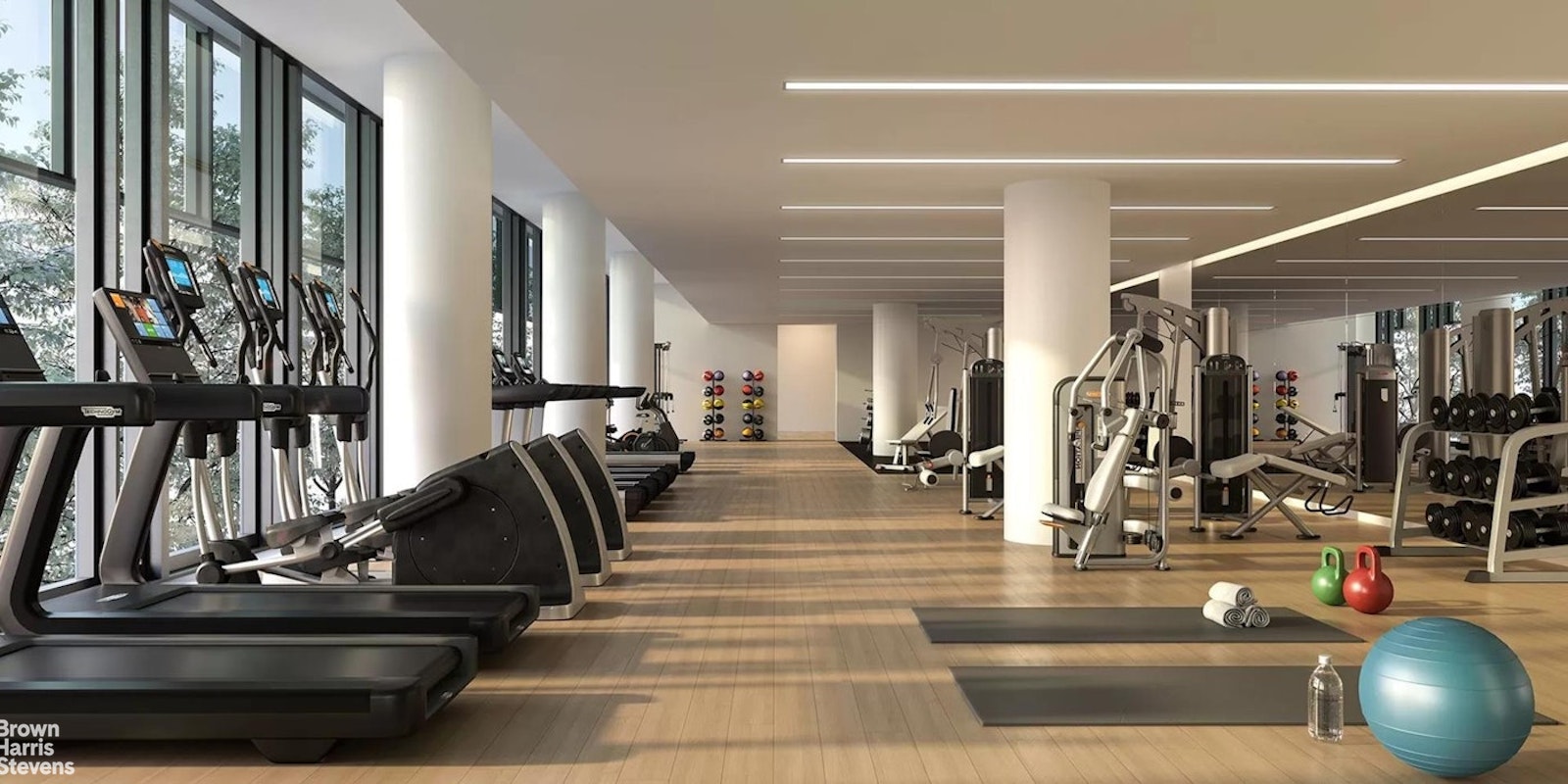 695 1st Avenue, Unit 28E Manhattan, NY 10016 - Photo 10 of 15 a view of a gym room with lots of gym equipment