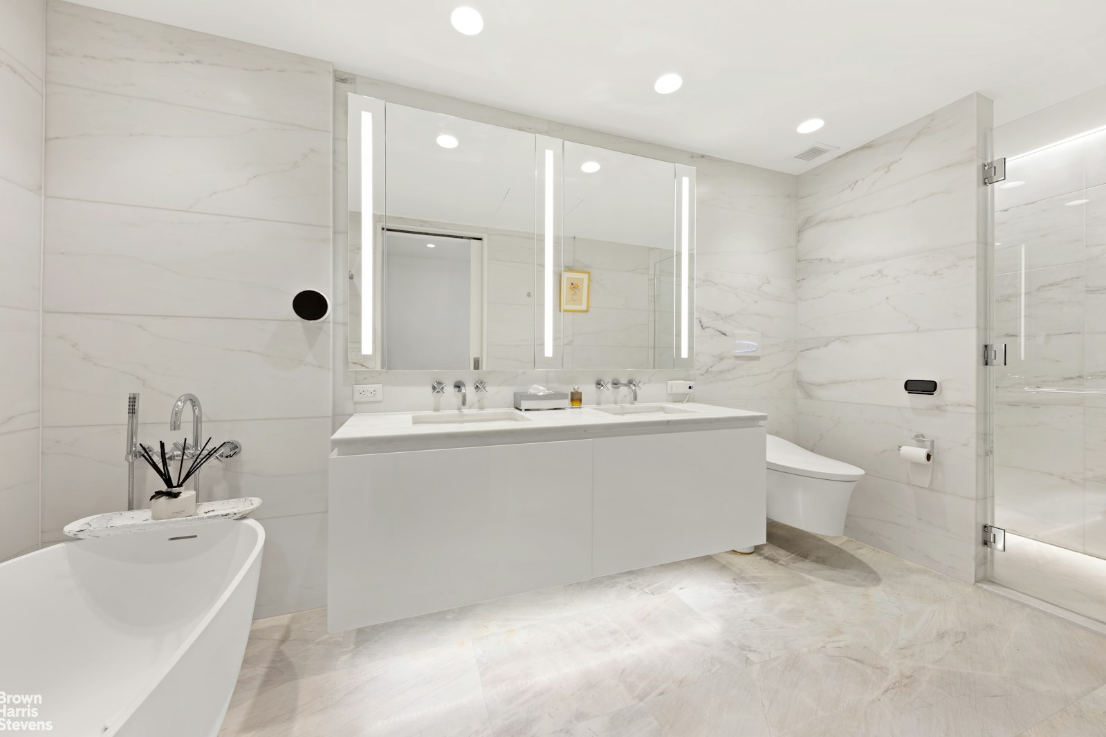 695 1st Avenue, Unit 28E Manhattan, NY 10016 - Photo 9 of 15 a bathroom with a double vanity sink mirror and toilet