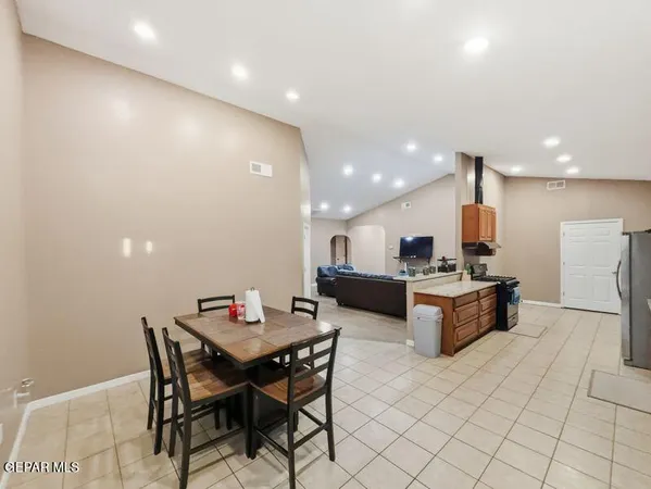 a kitchen with a table and chairs in it