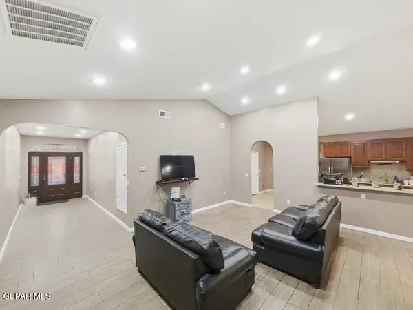 a living room with furniture and a fireplace