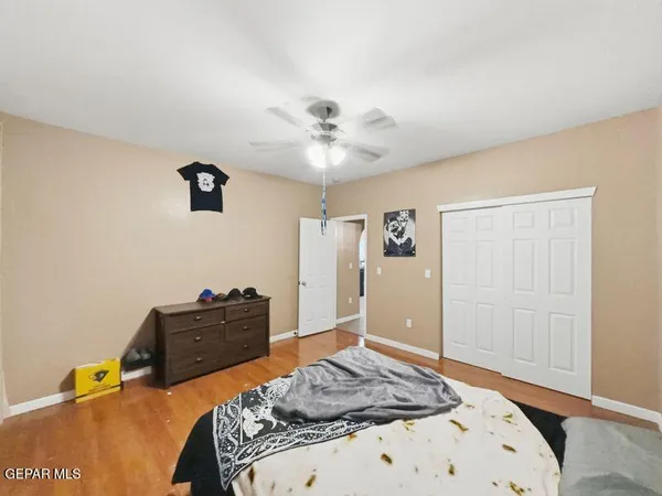 a bedroom with a bed and a dresser
