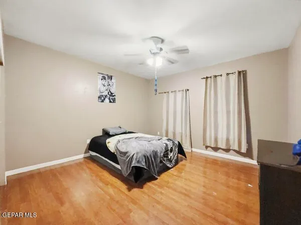 a living room with furniture a rug and a chandelier