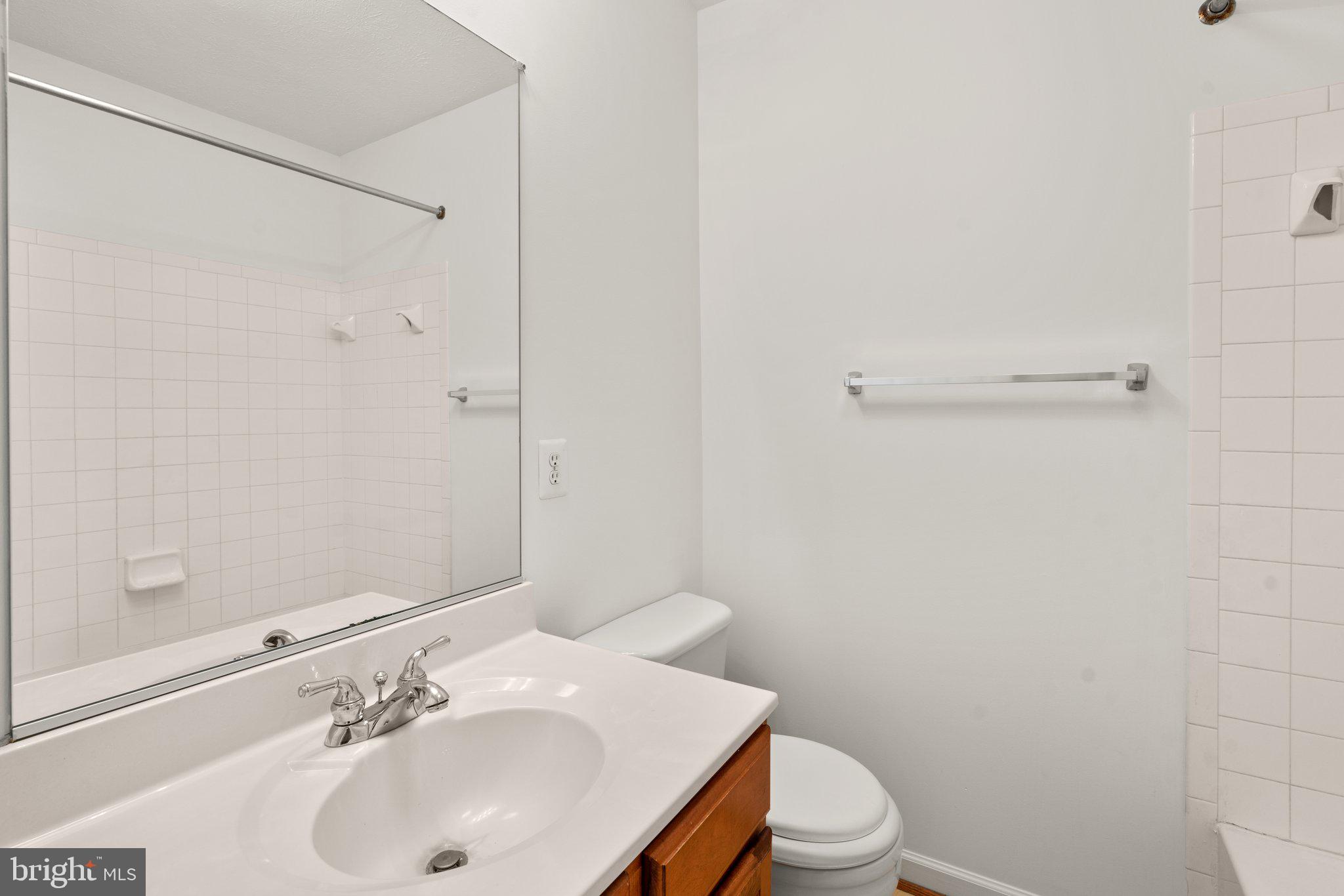 887 Middle River Road Middle River, MD 21220 - Photo 29 of 42 a bathroom with a sink toilet and vanity