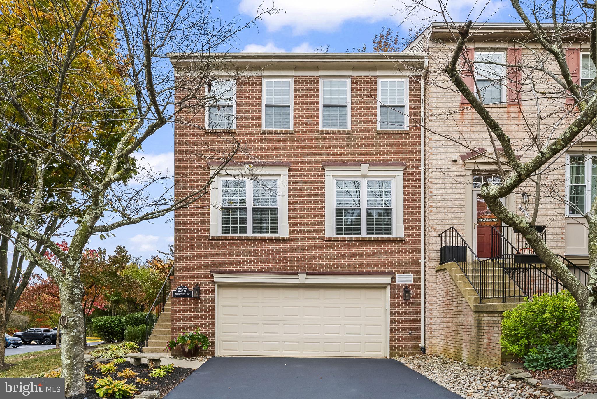 6267 Taliaferro Way Alexandria, VA 22315 - Photo 1 of 49 front view of a house with a yard