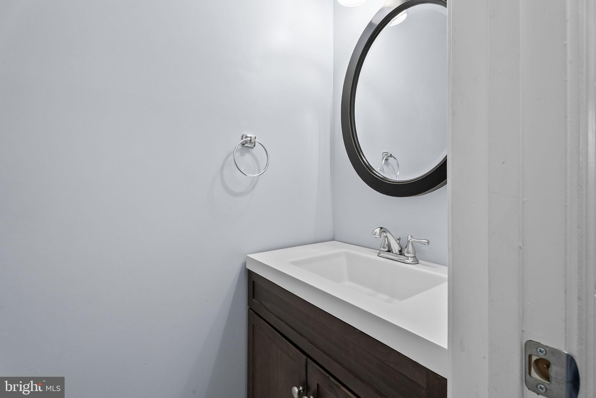 6267 Taliaferro Way Alexandria, VA 22315 - Photo 18 of 49 a bathroom with a sink and a mirror