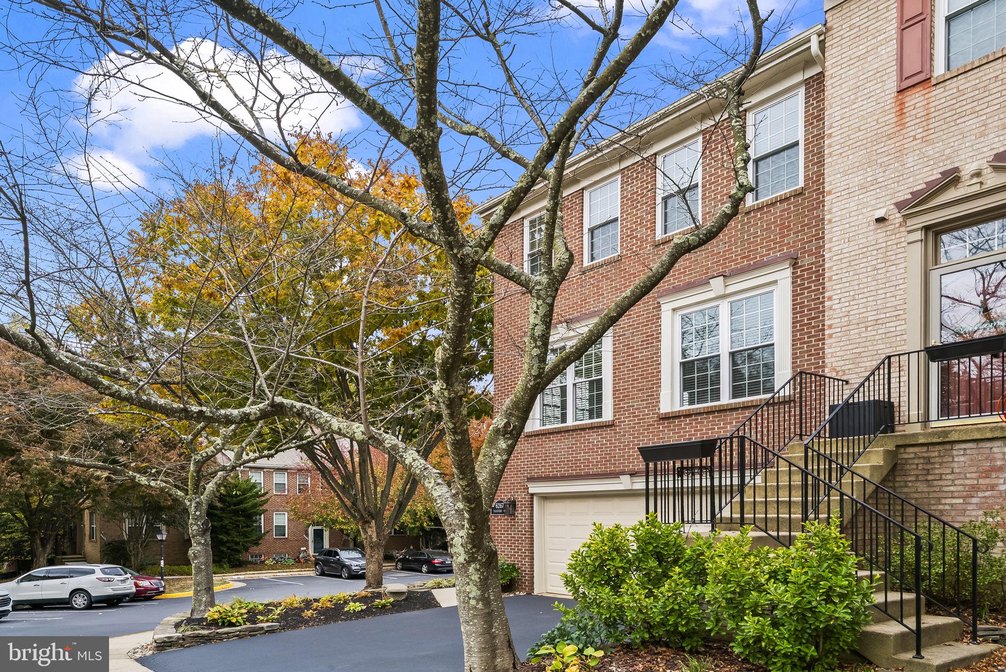 6267 Taliaferro Way Alexandria, VA 22315 - Photo 2 of 49 a view of a building with a yard