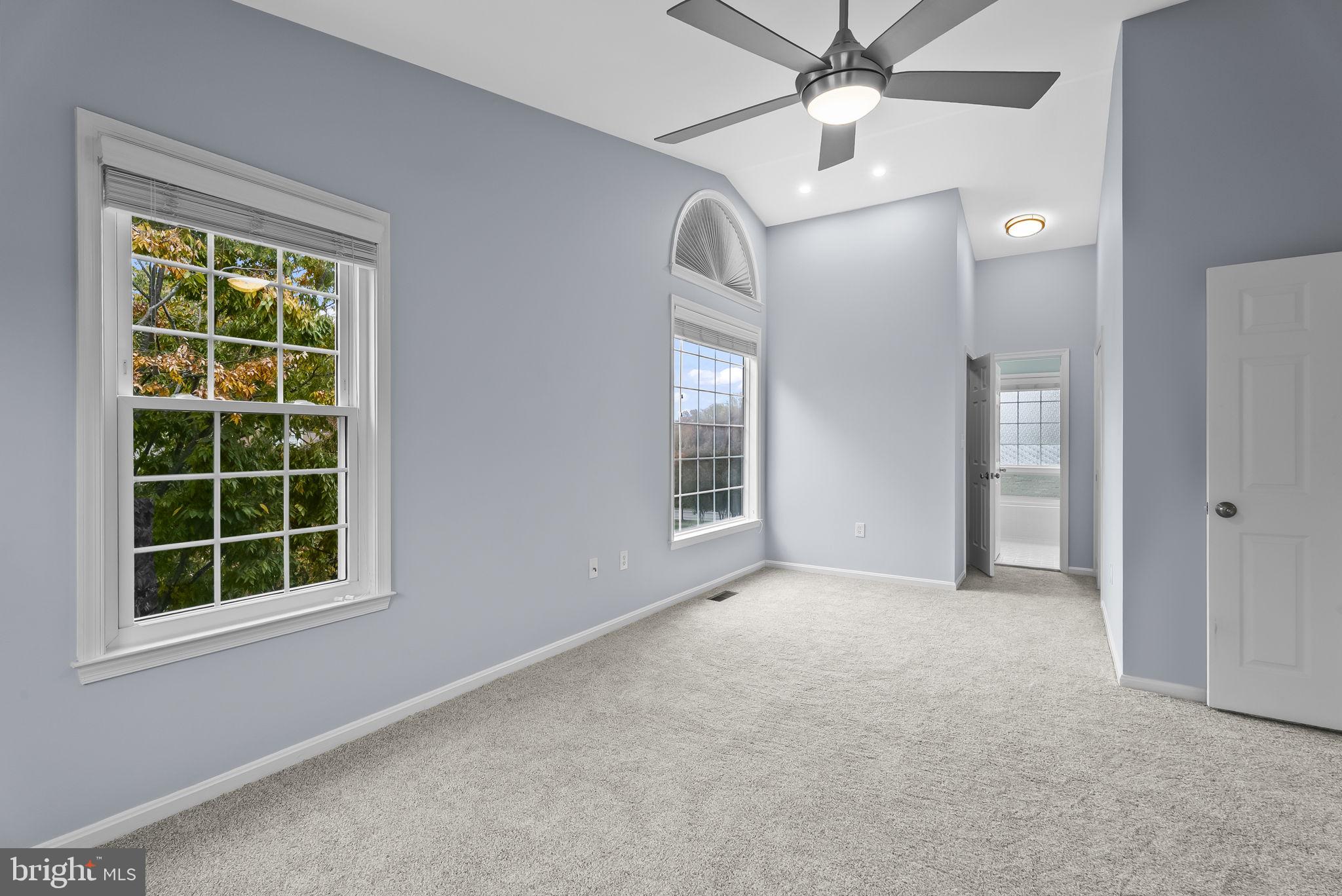 6267 Taliaferro Way Alexandria, VA 22315 - Photo 22 of 49 an empty room with windows and fan