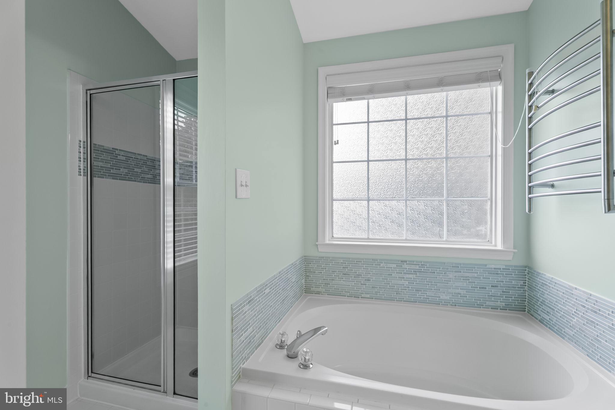 6267 Taliaferro Way Alexandria, VA 22315 - Photo 25 of 49 a white bath tub sitting next to a window
