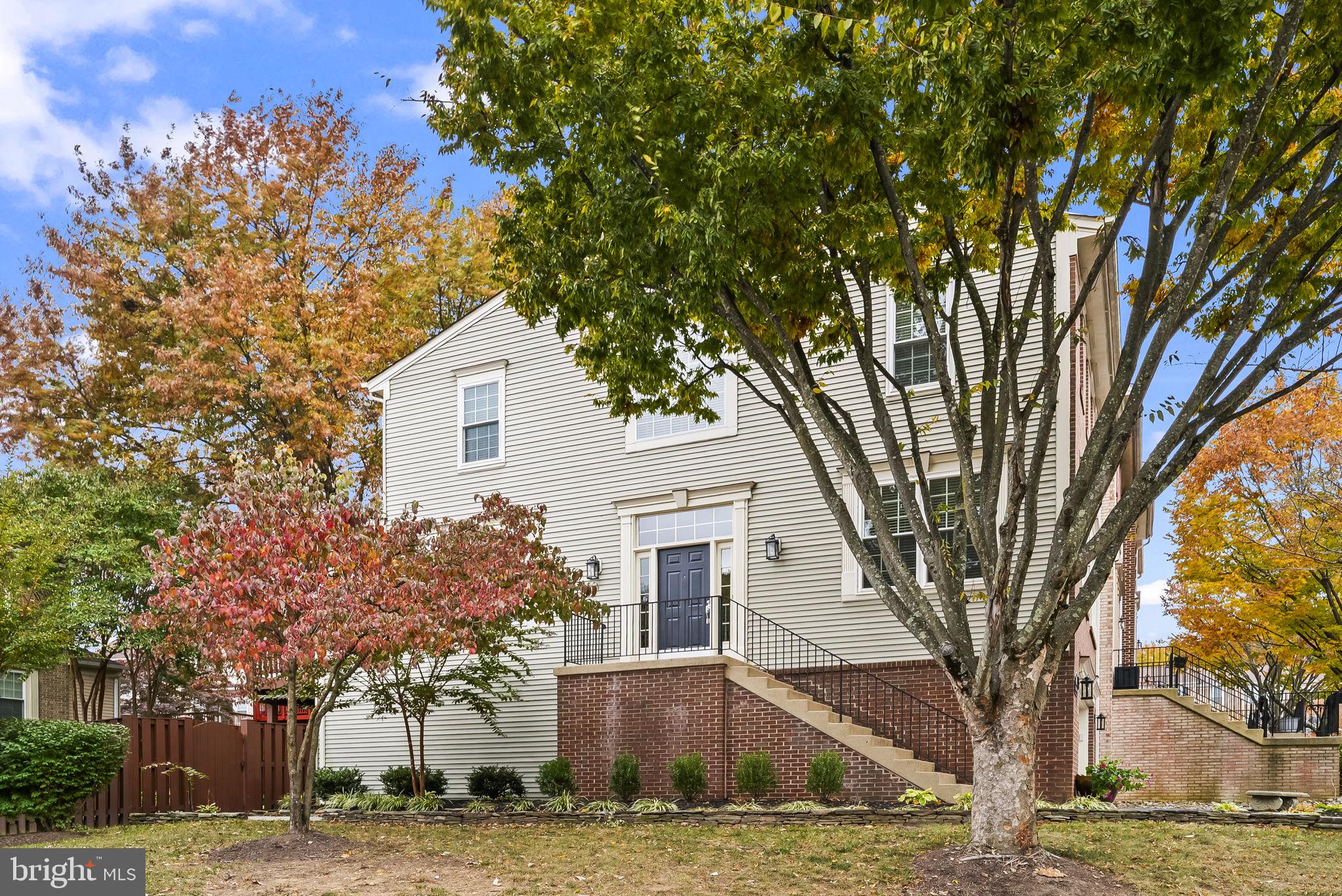 6267 Taliaferro Way Alexandria, VA 22315 - Photo 4 of 49 a front view of a house with a yard