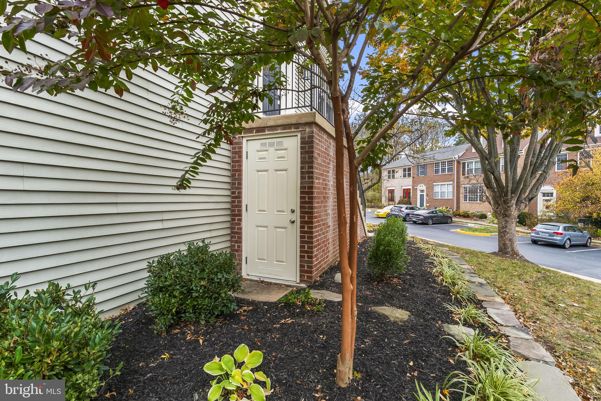 6267 Taliaferro Way Alexandria, VA 22315 - Photo 41 of 49 a front view of a house with a yard and a tree