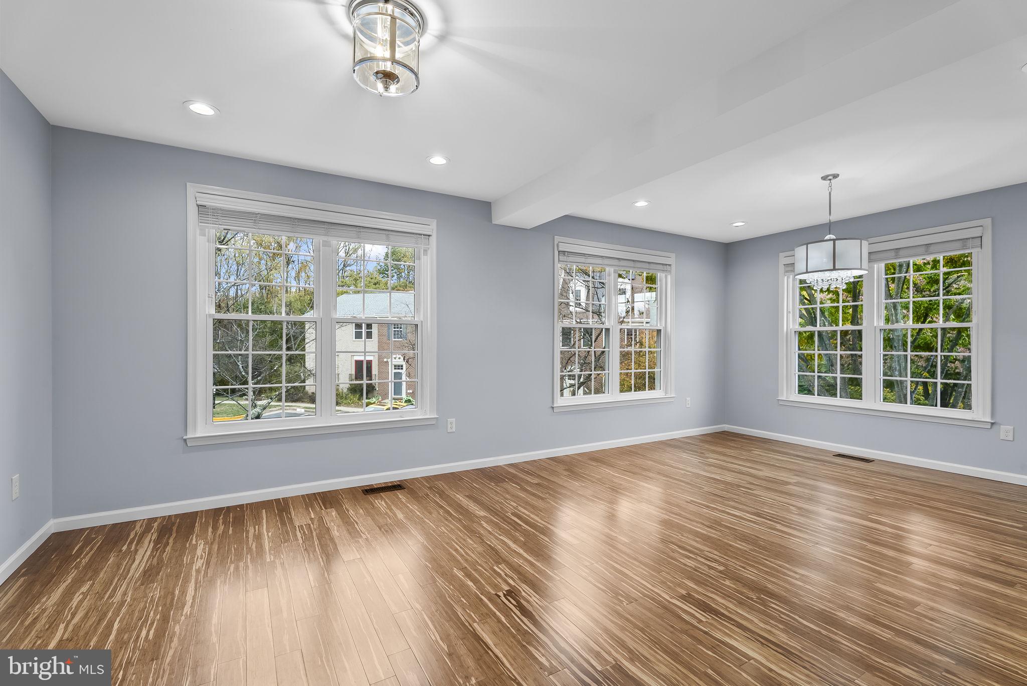 6267 Taliaferro Way Alexandria, VA 22315 - Photo 7 of 49 a view of an empty room with wooden floor and a window