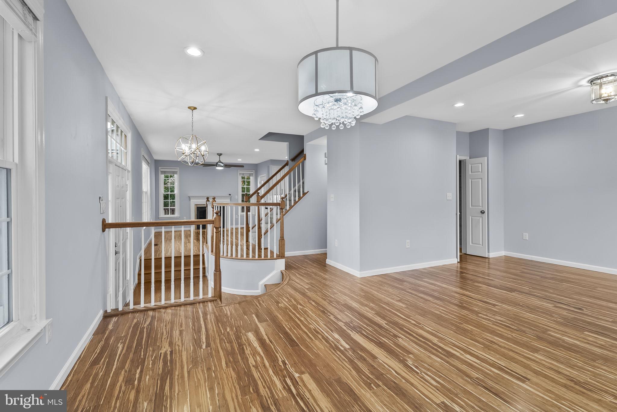 6267 Taliaferro Way Alexandria, VA 22315 - Photo 8 of 49 a view of entryway and hall with wooden floor