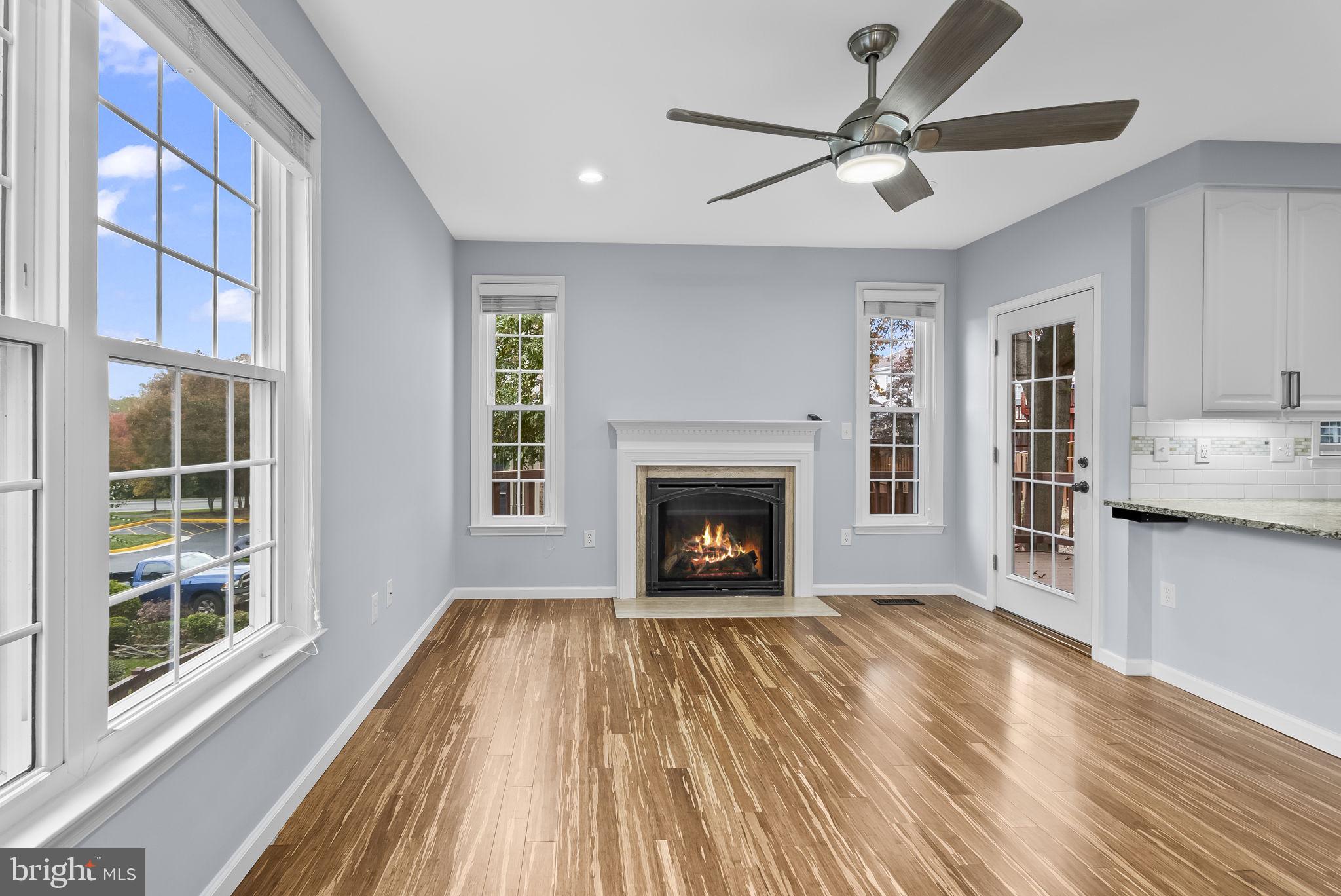 6267 Taliaferro Way Alexandria, VA 22315 - Photo 10 of 49 a view of an empty room with a fireplace and a window