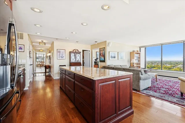 a kitchen with stainless steel appliances granite countertop a stove and a refrigerator