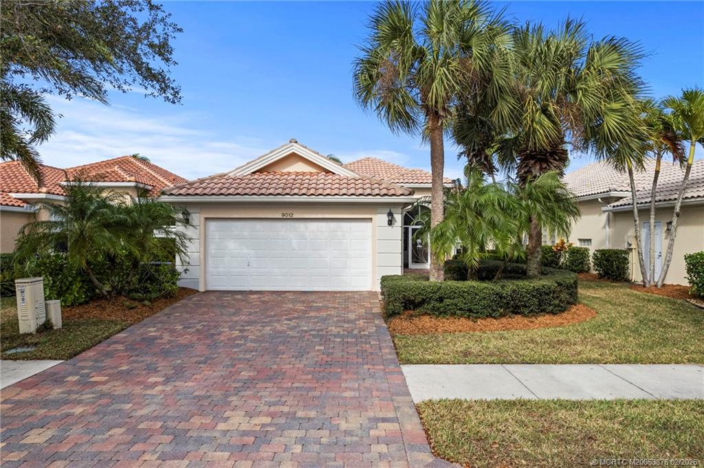 9012 Southeast Eldorado Way Hobe Sound, FL 33455 - Photo 2 of 25 Front entry garage