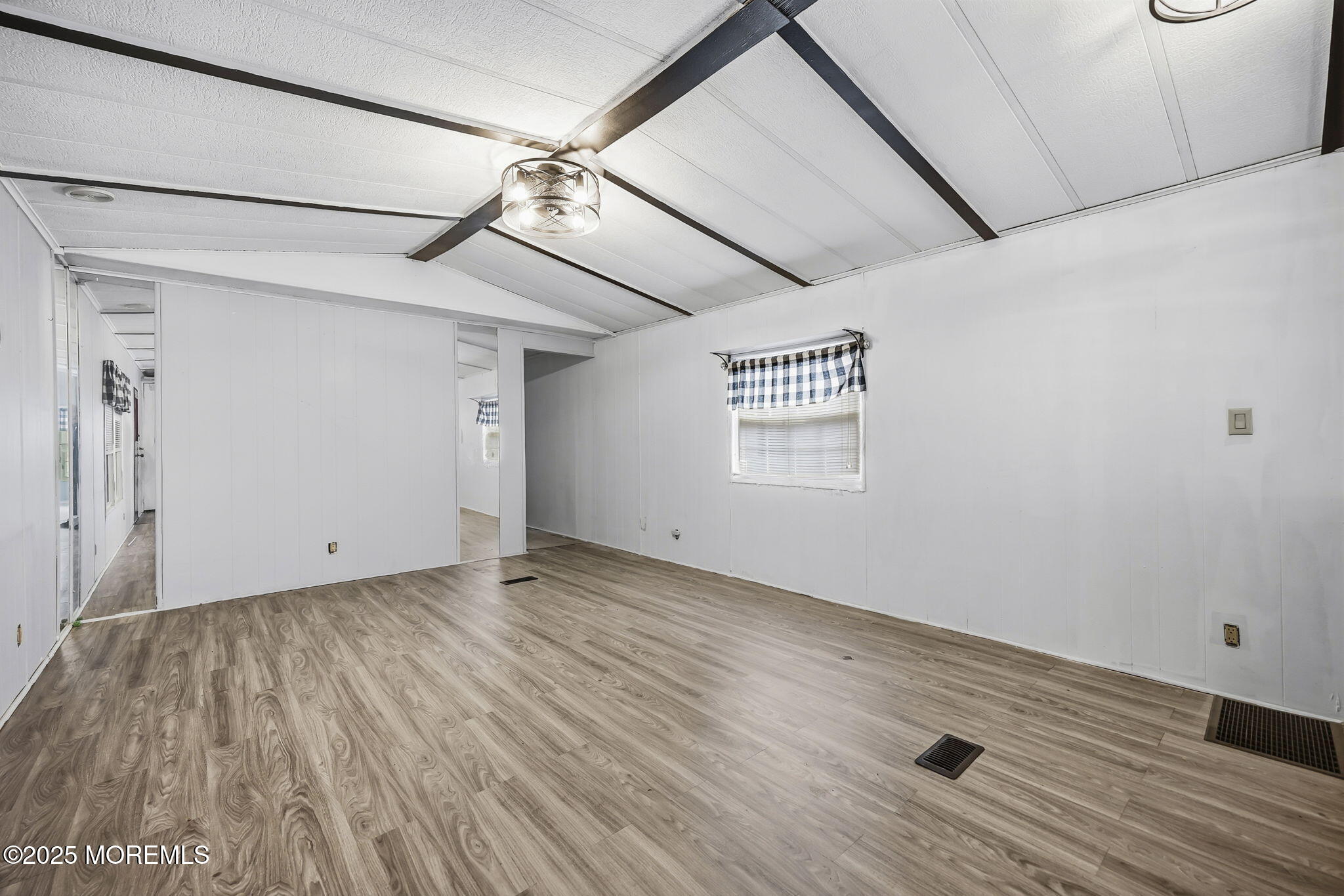 6 Taft Street Howell, NJ 07731 - Photo 6 of 22 a view of an empty room and a window