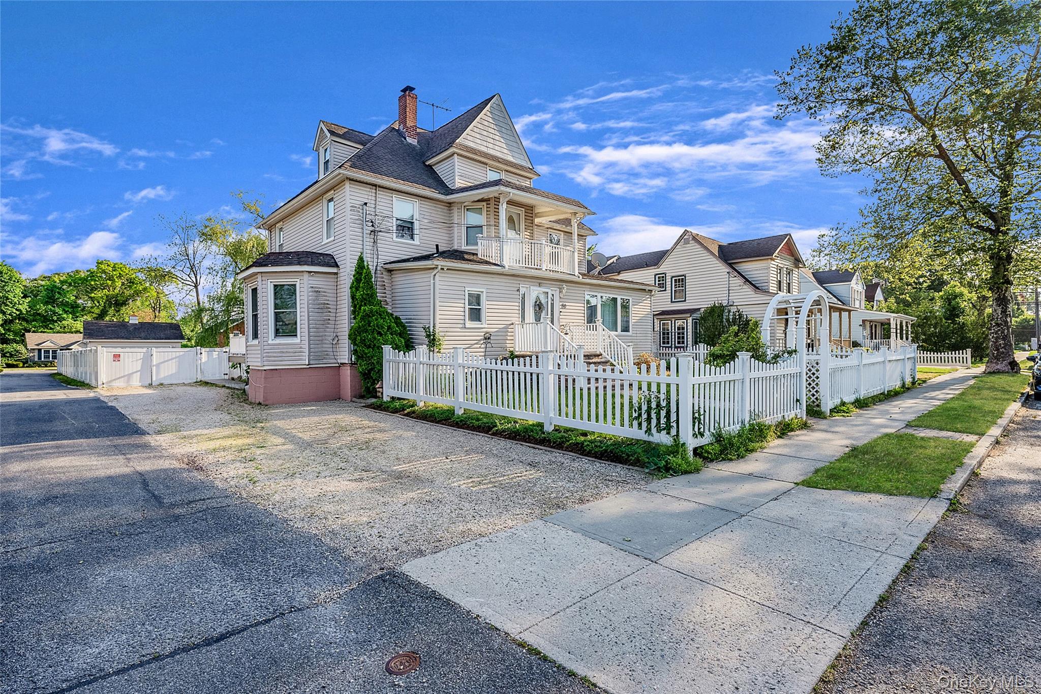 80 George Street Babylon, NY 11702 - Photo 2 of 41 a view of a house with a yard and plants