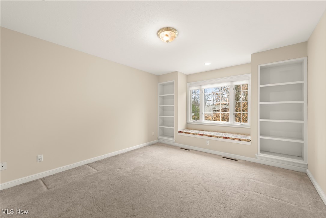 455 Old Reservoir Road Berea, OH 44017 - Photo 32 of 49 Spare room featuring built in features and carpet floors