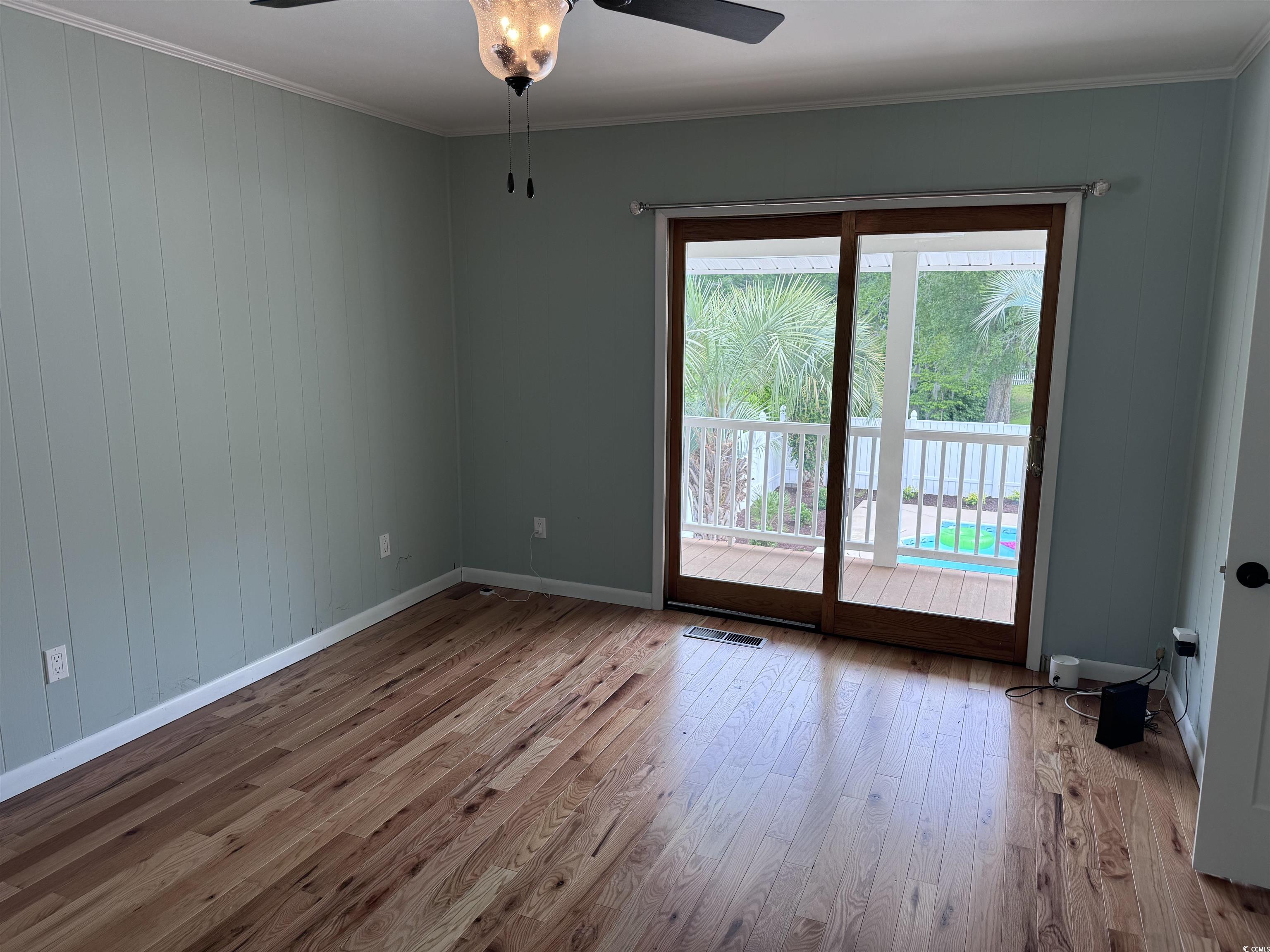 134 Mohican Drive Georgetown, SC 29440 - Photo 11 of 40 Spare room featuring ceiling fan, wood finished fl