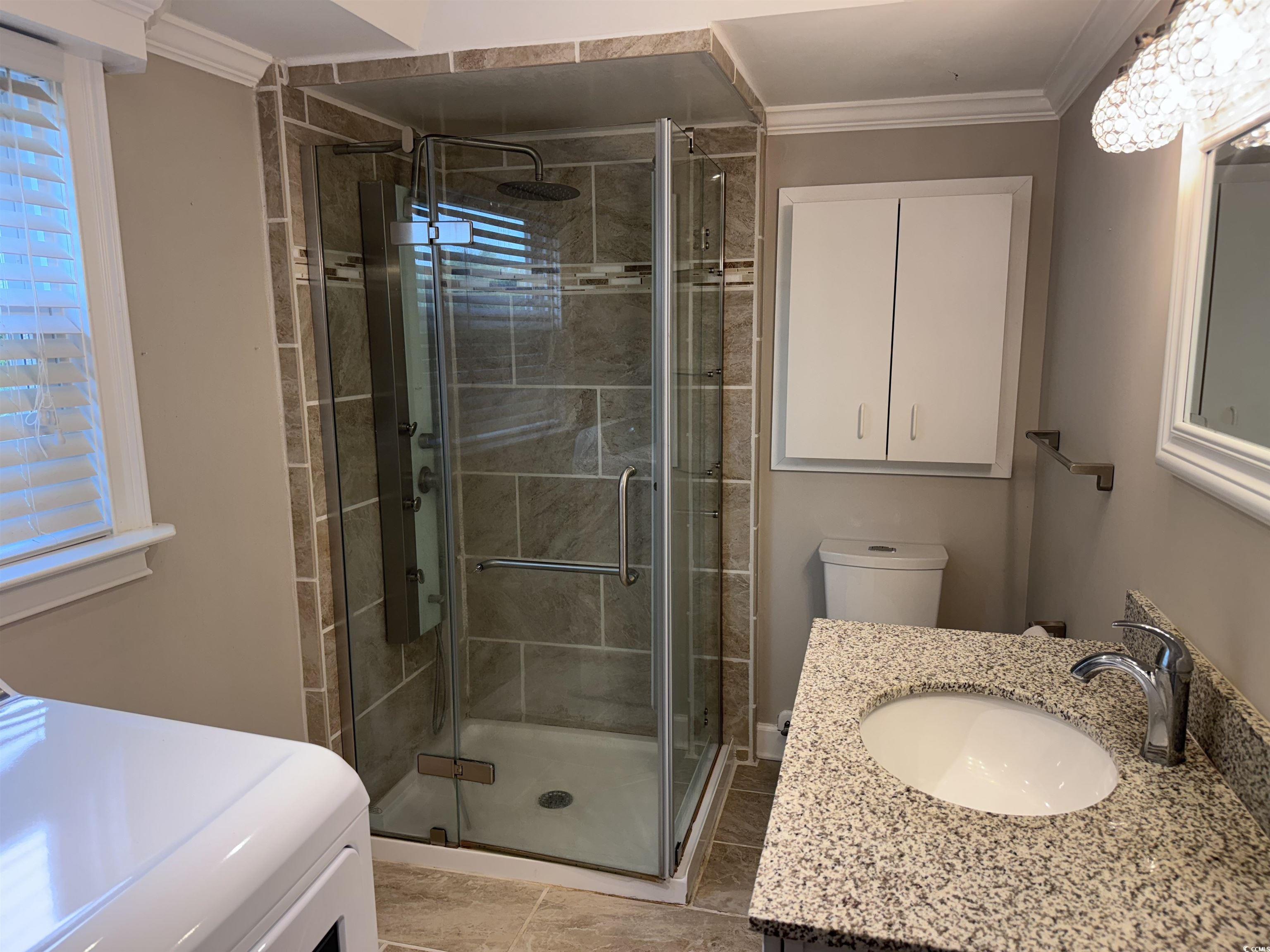134 Mohican Drive Georgetown, SC 29440 - Photo 15 of 40 Bathroom with a stall shower, ornamental molding,