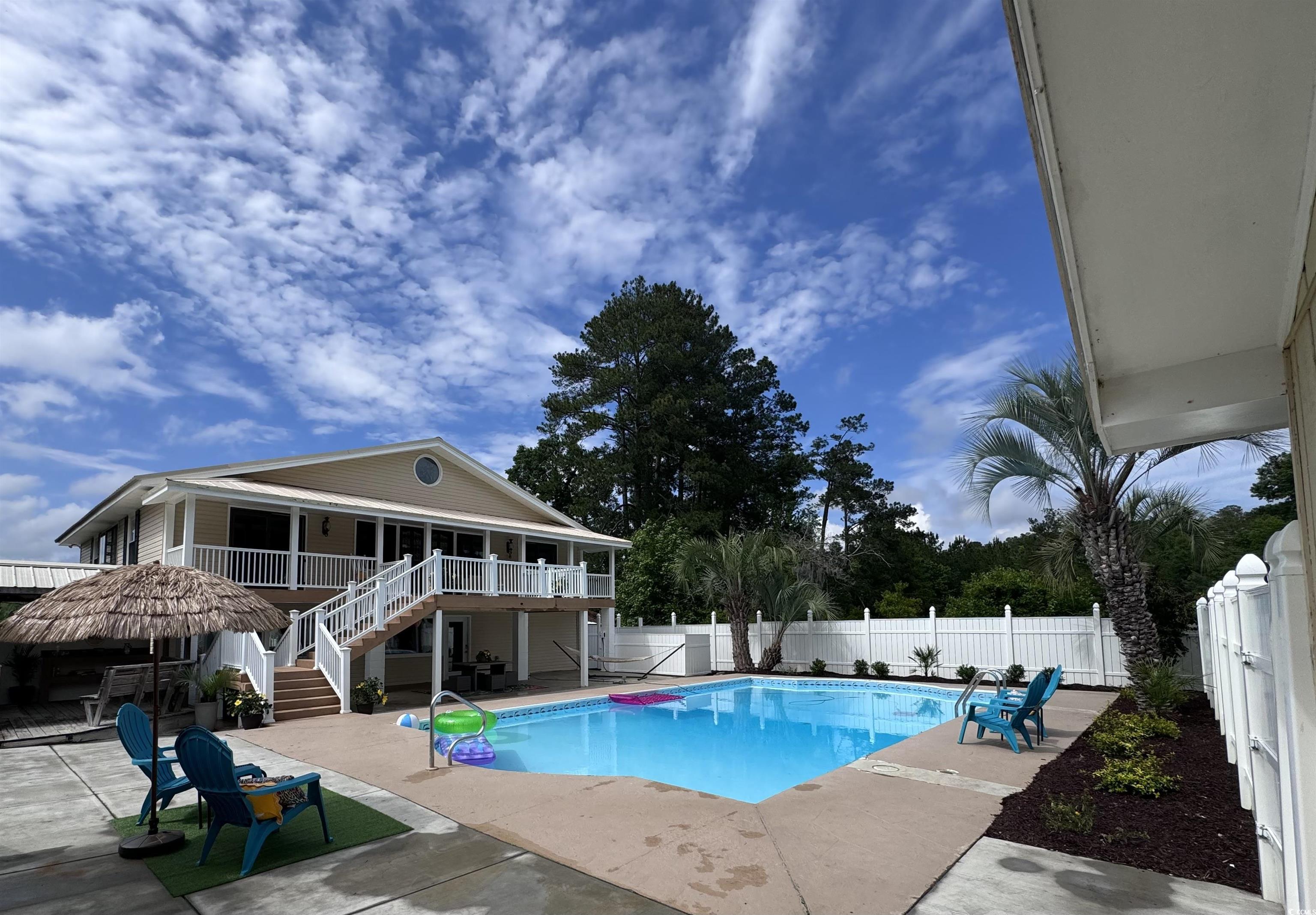 134 Mohican Drive Georgetown, SC 29440 - Photo 35 of 40 View of swimming pool with stairs, a fenced backya