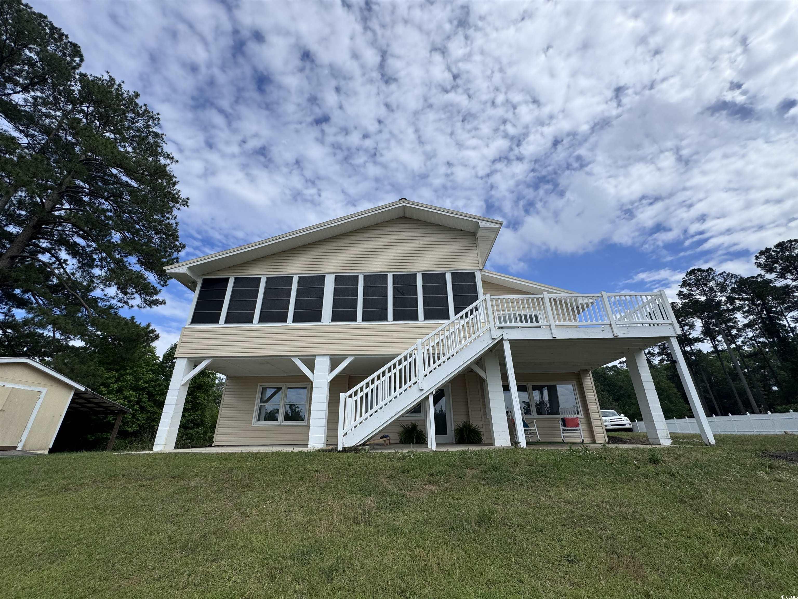 134 Mohican Drive Georgetown, SC 29440 - Photo 38 of 40 Rear view of property featuring stairway, a storag