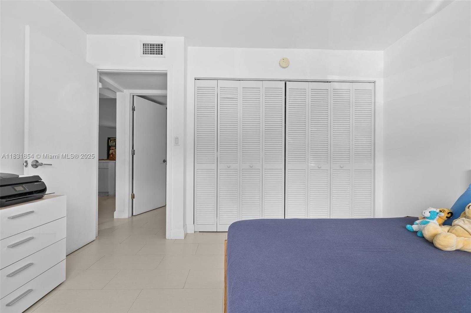 240 Galen Drive, Unit 109 Key Biscayne, FL 33149 - Photo 14 of 30 a view of a bedroom with closet area