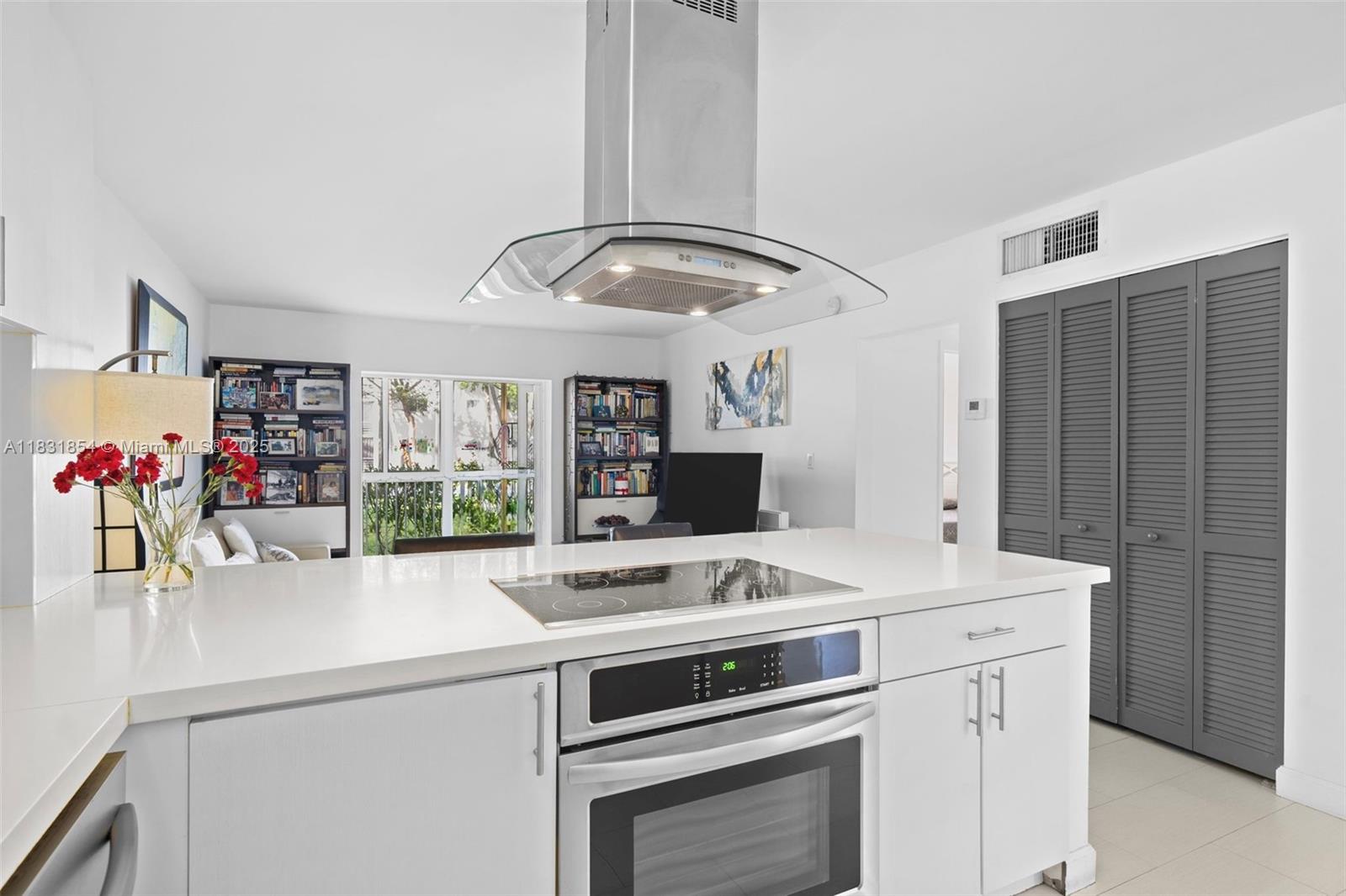 240 Galen Drive, Unit 109 Key Biscayne, FL 33149 - Photo 4 of 30 a kitchen that has a sink and a stove in it