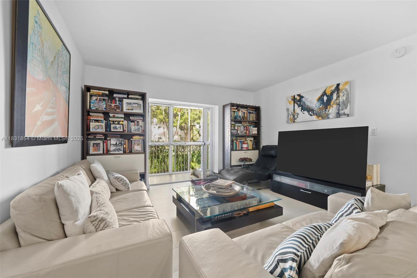 240 Galen Drive, Unit 109 Key Biscayne, FL 33149 - Photo 7 of 30 a living room with furniture and a flat screen tv