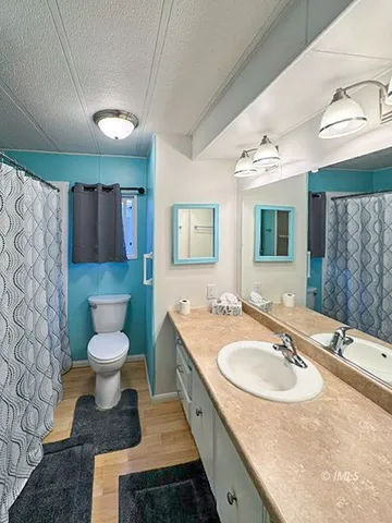 a bathroom with a sink double vanity and a toilet