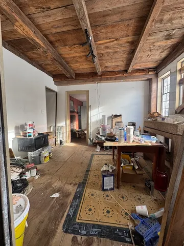 a bedroom with furniture and a fireplace