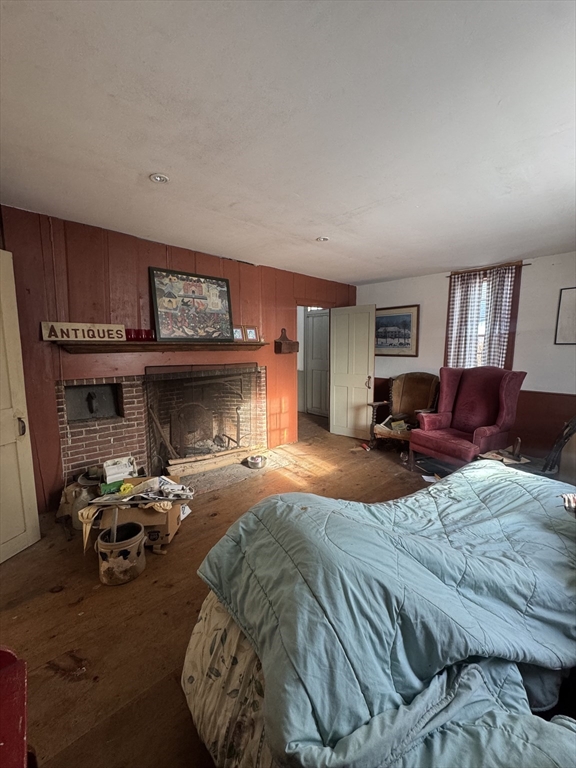 804 Main Street Ashby, MA 01431 - Photo 5 of 11 a bedroom with furniture and a fireplace