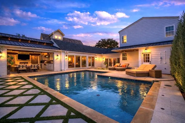 a view of swimming pool with outdoor seating