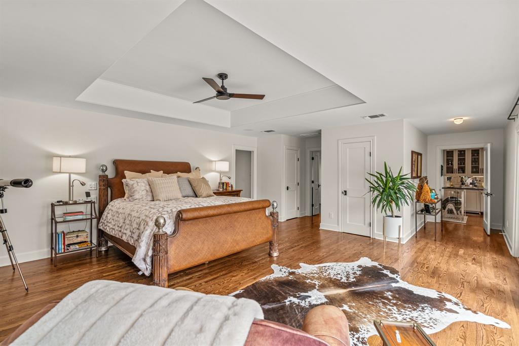 3913 Hamilton Avenue Fort Worth, TX 76107 - Photo 17 of 40 a bedroom with a bed and a potted plant