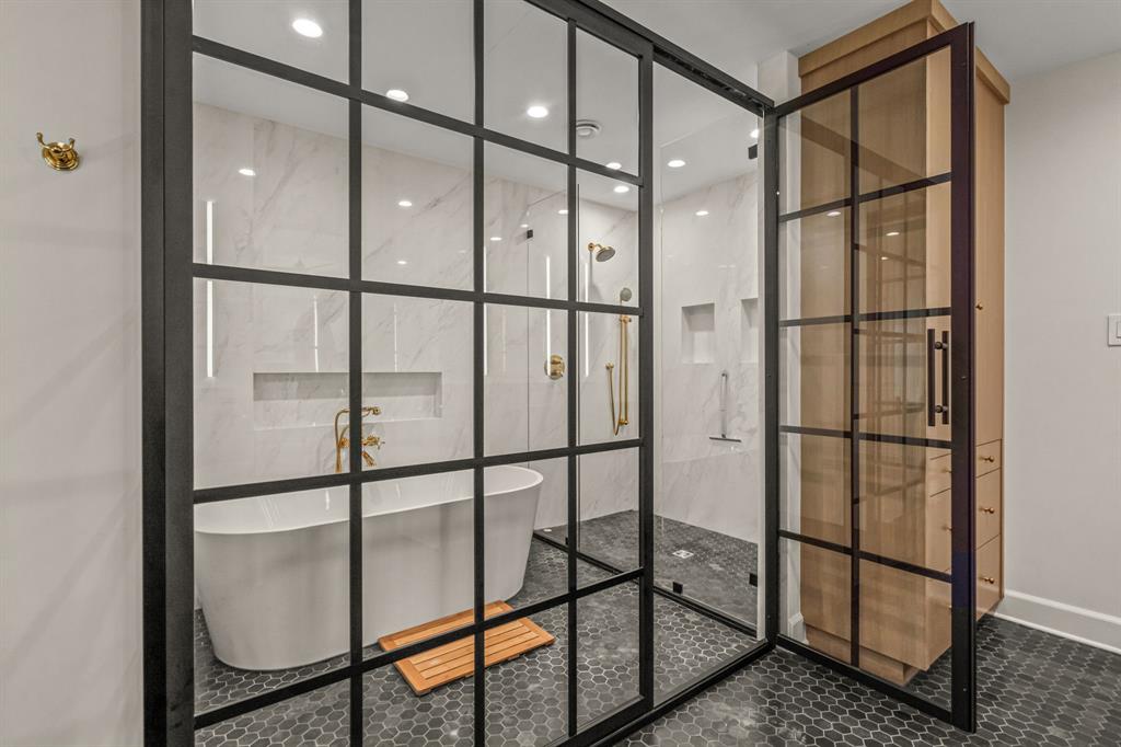 3913 Hamilton Avenue Fort Worth, TX 76107 - Photo 18 of 40 a bathroom with a glass shower door