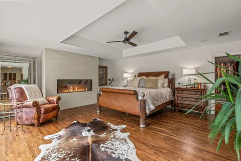 a bedroom with a bed and a potted plant