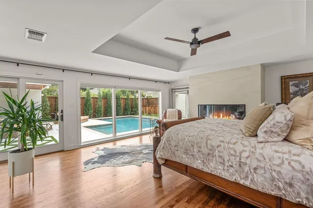 a view of walk in closet with clothes