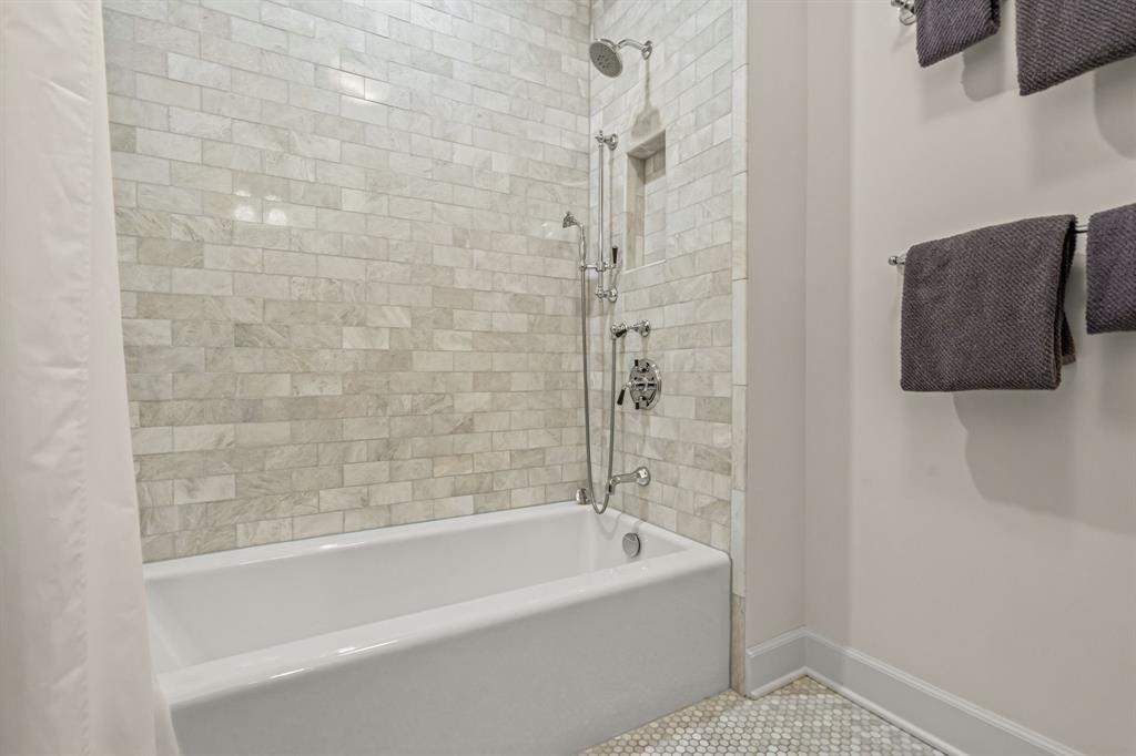 3913 Hamilton Avenue Fort Worth, TX 76107 - Photo 23 of 40 a bathroom with a bathtub and shower