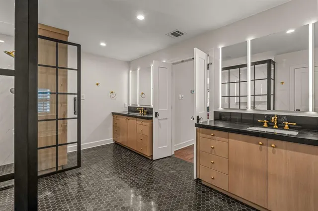 a bathroom with a bathtub and a shower