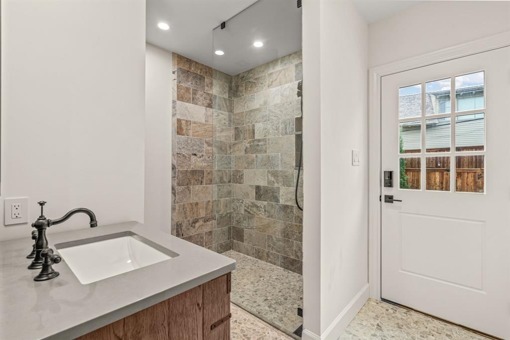 3913 Hamilton Avenue Fort Worth, TX 76107 - Photo 28 of 40 a bathroom with a sink a toilet and shower