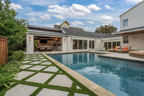 a living room with fireplace furniture and a flat screen tv