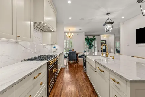 a large kitchen with granite countertop a lot of counter space