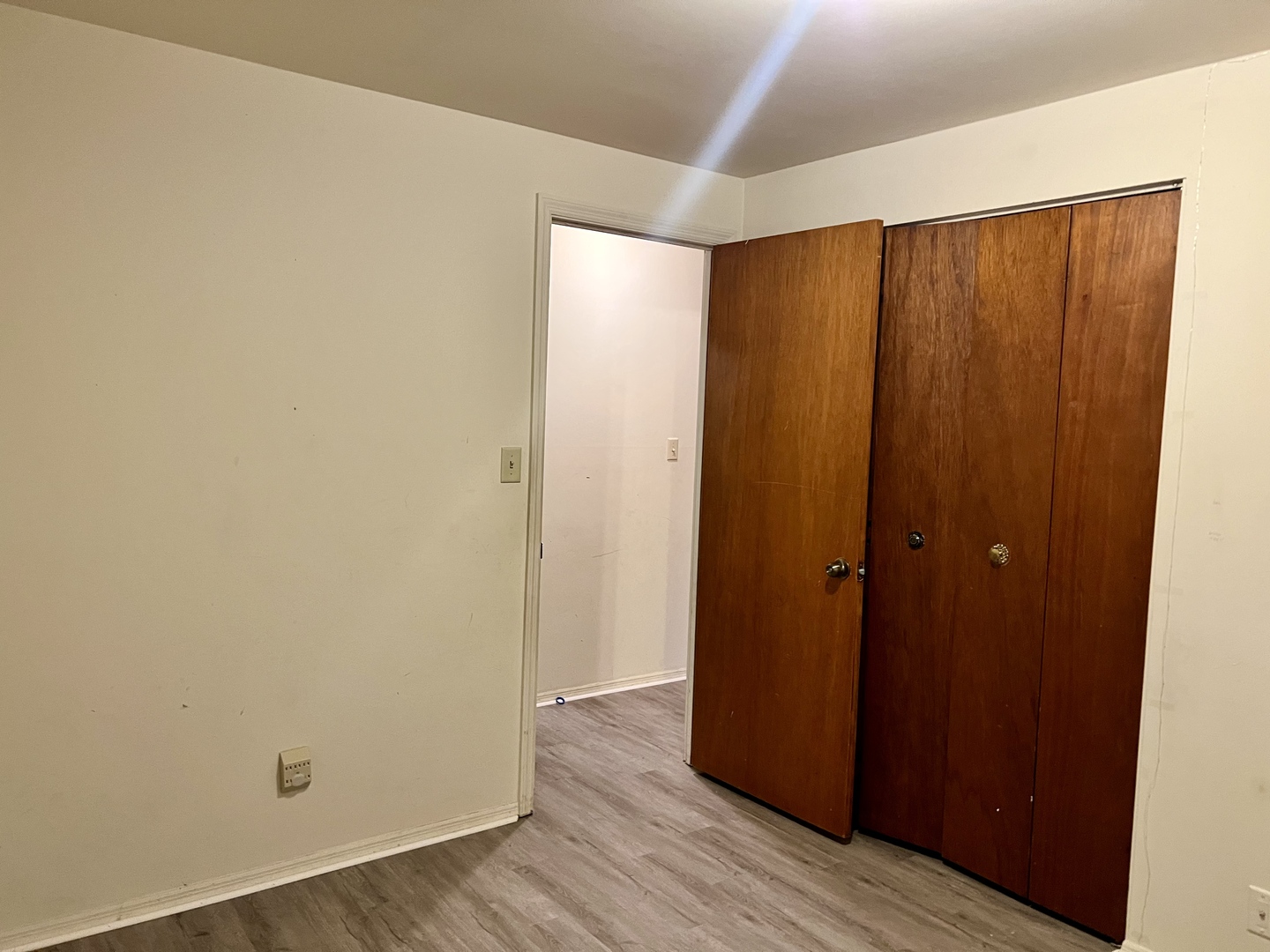 2504 Campbell Drive Champaign, IL 61821 - Photo 16 of 24 an empty room with wooden floor and closet area