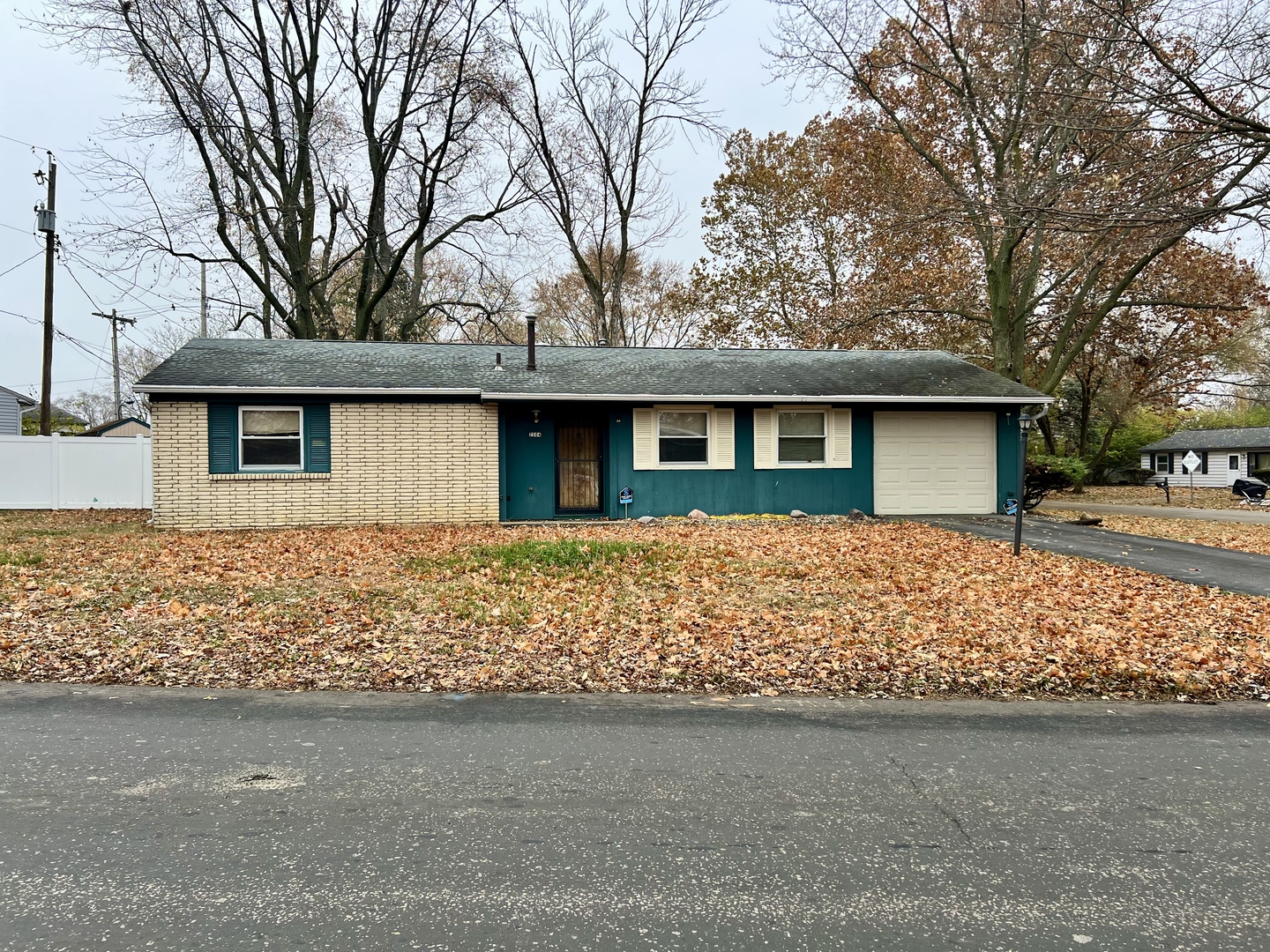 2504 Campbell Drive Champaign, IL 61821 - Photo 2 of 24 a front view of a house with garden