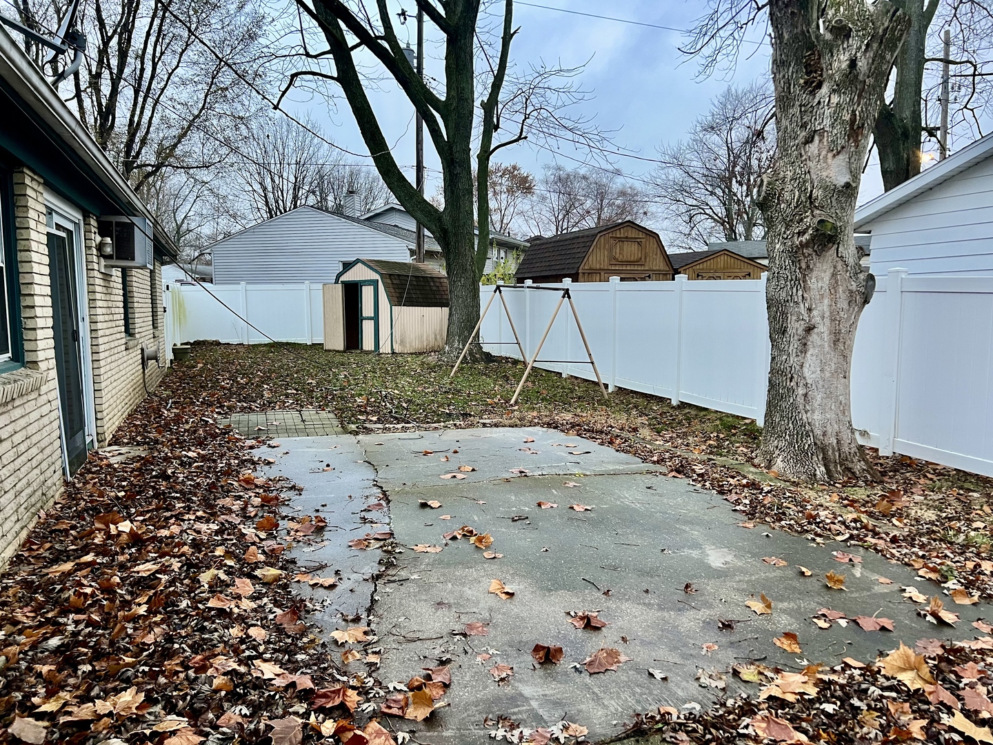 2504 Campbell Drive Champaign, IL 61821 - Photo 23 of 24 a backyard of a house with large trees