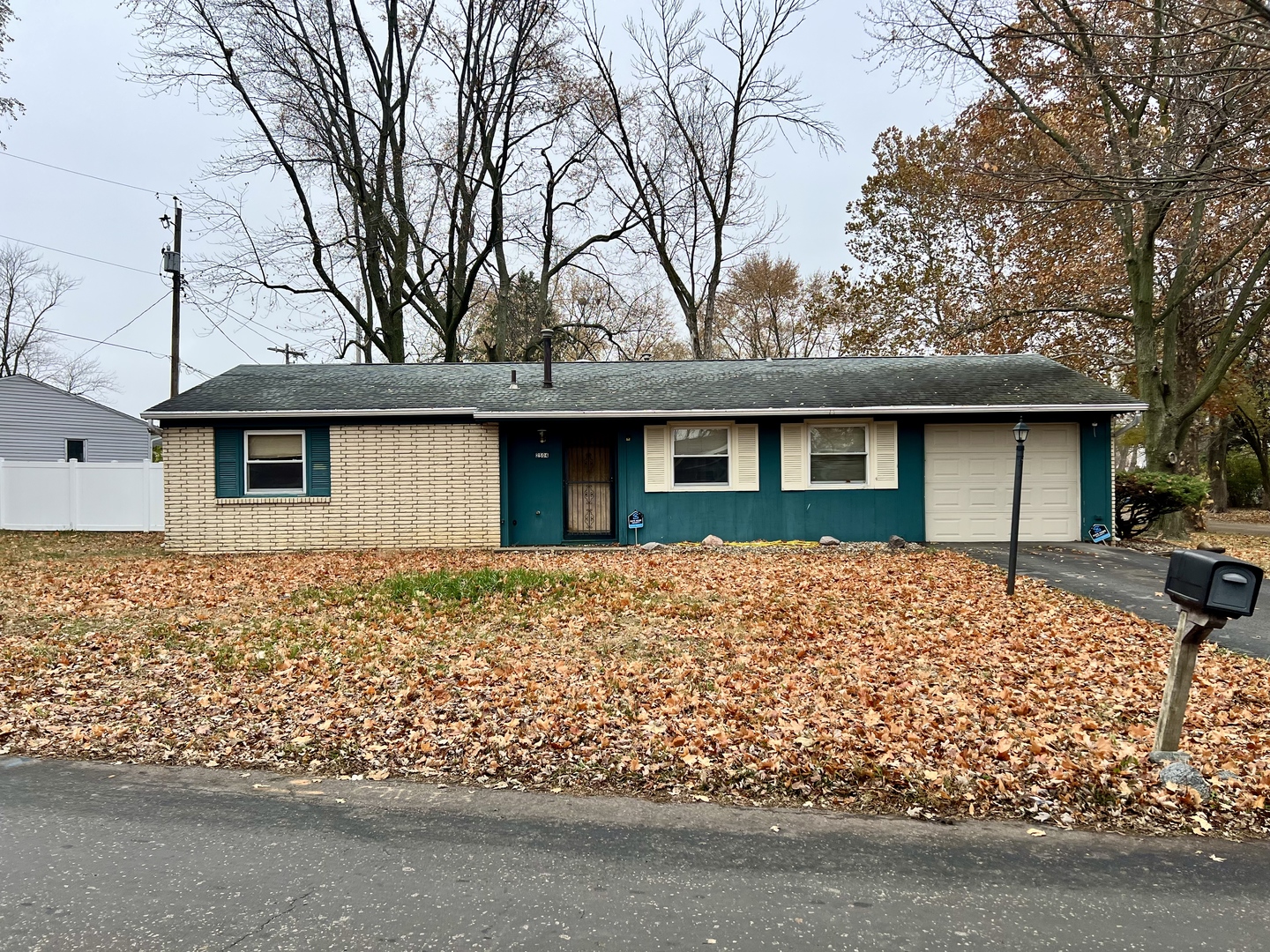 2504 Campbell Drive Champaign, IL 61821 - Photo 3 of 24 a front view of a house with garden