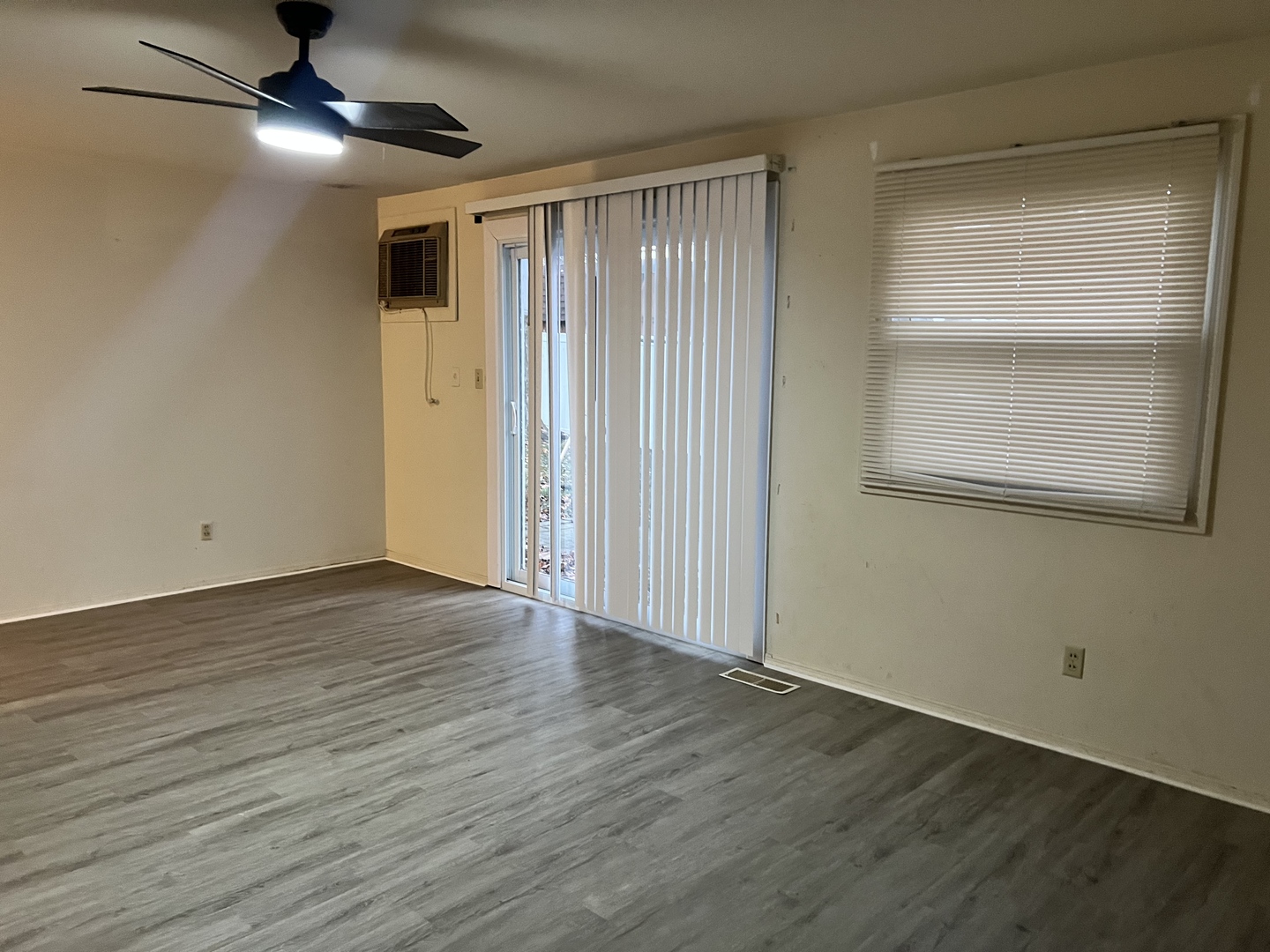 2504 Campbell Drive Champaign, IL 61821 - Photo 8 of 24 a view of an empty room with wooden floor and a window