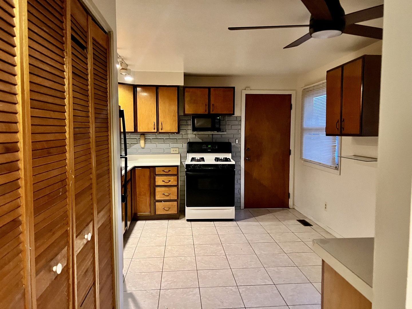 2504 Campbell Drive Champaign, IL 61821 - Photo 9 of 24 a kitchen with stainless steel appliances a refrigerator and a stove top oven