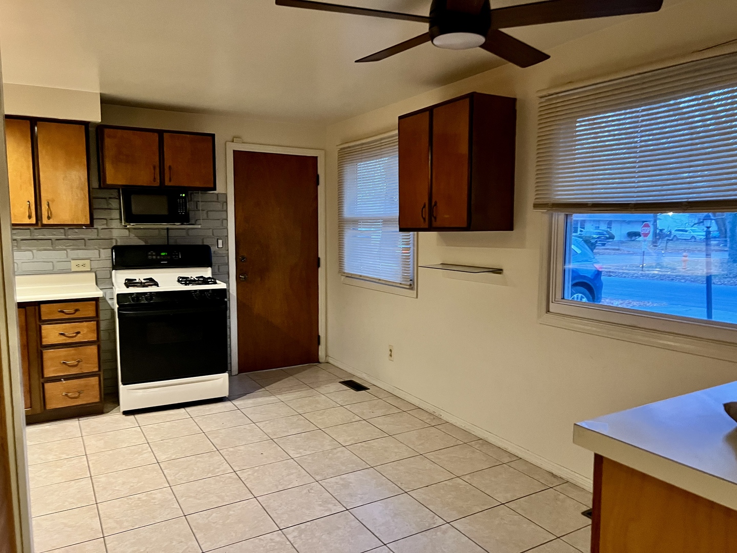 2504 Campbell Drive Champaign, IL 61821 - Photo 10 of 24 a kitchen with stainless steel appliances granite countertop a stove and a refrigerator