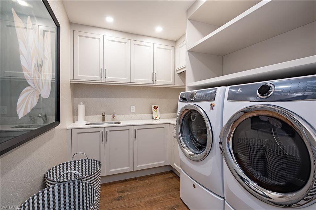 13915 Old Coast Road, Unit 602 Naples, FL 34110 - Photo 21 of 37 a utility room with sink dryer and washer